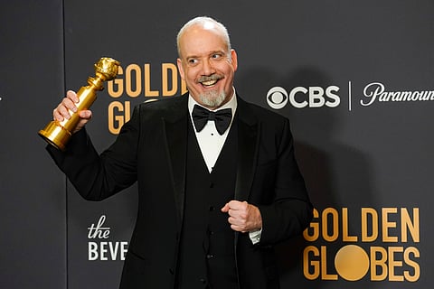 Paul Giamatti poses in the press room with the award for best performance by an actor in a motion picture, musical or comedy for "The Holdovers" at the 81st Golden Globe Awards on Sunday, Jan. 7, 2024, at the Beverly Hilton in Beverly Hills, Calif. 