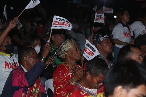Members of the Indigenous peoples (IP) community are seen holding a flaglet with the text "Filipinos are not for sale" during the prayer rally against the People's initiative at the San Pedro Square in Davao City on January 28, 2024 at the San Pedro Square.