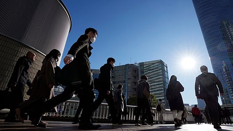 Commuters walk in a passageway during a rush hour at Shinagawa Station on Wednesday, February 14, 2024, in Tokyo. Japan has slipped to the world’s fourth-largest economy as government data released Thursday, February 15, 2024, showed it fell behind the size of Germany in 2023. 