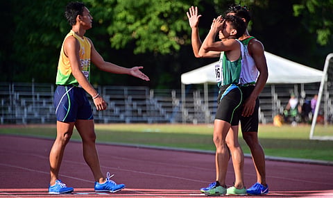 TEARS OF JOY. Lorenz “Soysoy” Datiles of Santo Tomas, Davao del Norte, center, reacts after a gold medal finish in one of his five events in the recently concluded Davao Region Athletic Association (Davraa) Meet 2024 athletics competition at the University of Mindanao (UM) track oval.