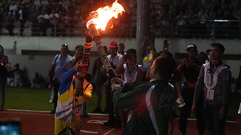 Bemedaled Dabawenyo athletes lead the lighting of the cauldron during the opening ceremonies of the Davao Region Athletics Association (Davraa) Meet 2024 at the DC-UP Sports Complex, UP Mindanao, Davao City on Monday evening, April 1, 2024.
