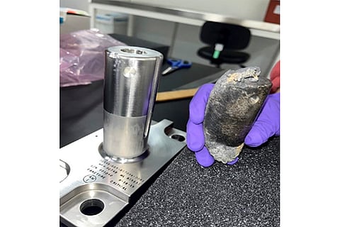 This undated photo provided by NASA shows a recovered chunk of space junk from equipment discarded at the International Space Station. The cylindrical object that tore through a home in Naples, Fla., March 8, 2024, was subsequently taken to the Kennedy Space Center in Cape Canaveral, Fla., for analysis. 