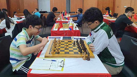 
FINAL MATCH. At right, Panabo City-born Fide master (FM) Christian Gian Karlo Arca, now based in  Dasmariñas City, Cavite plays against candidate master (CM) Dau Khuong Duy of Vietnam in the final round of the Quang Ninh GM2 chess tournament in Ha Long City, Vietnam, on Sunday, May 19, 2024. Arca secures the gold medal for the Philippines after earning six points. 
