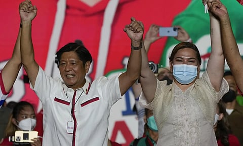 Presidential candidate, Ferdinand Marcos Jr., the son of the late dictator, left, raises arms with running mate Davao City Mayor Sara Duterte, the daughter of the current President, during their last campaign rally Saturday, May 7, 2022, in Paranaque city, Philippines. Marcos Jr. and Duterte are the new leaders of the Philippines, an alliance that ushers in six years of governance that has some human rights activists concerned about the course their country may take with the pair in power.