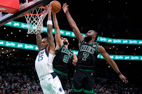 FORMIDABLE DEFENSE. Dallas Mavericks forward P.J. Washington (25) is blocked by Boston Celtics' Derrick White (9) and Jaylen Brown (7) during the second half of Game 2 of the NBA Finals basketball series, Sunday, June 9, 2024, in Boston (Monday, June 10, PH time). 