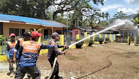 SAFETY HEROES. Community volunteers in Barangay Santiago and Maluko, Manolo Fortich, Bukidnon, gear up for intensive firefighting training, ready to protect their communities. 