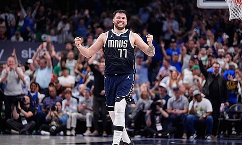 Dallas Mavericks guard Luka Doncic (77) reacts after a play during the first half in Game 4 of the NBA basketball finals against the Boston Celtics, Friday, June 14, 2024, in Dallas.