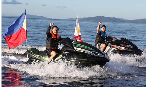 Then-Special Assistant to the President now Christopher "Bong" Go and then civilian, now current Davao City Mayor Sebastian Duterte ride jet skis as they take a tour around the Casiguran Sound during the Philippine Rise commemoration on May 15, 2018.