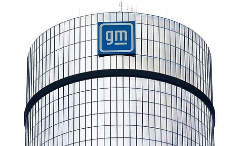 A General Motors logo is seen on a building, April 24, 2024, in Detroit. GM will pay nearly $146 million in penalties to the federal government because 5.9 million of its older vehicles don’t comply with emissions and fuel economy standards. 