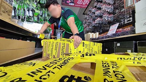 UNCERTIFIED APPLIANCES. DTI seals uncertified household appliances in a warehouse in Plaridel, Bulacan on July 31. (Photo courtesy of DTI)