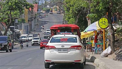 Jeepney, taxi on bike lane