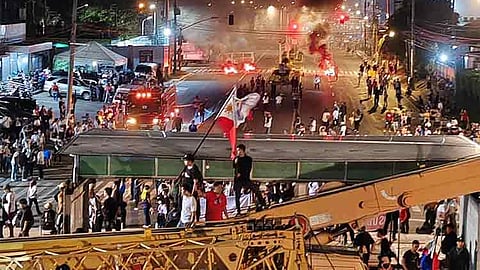 DAVAO. Hundreds of Kingdom of Jesus Christ (KOJC) members and supporters are holding a protest outside the KOJC compound following the entry of thousands of police to search for Pastor Apollo C. Quiboloy on Sunday, August 25, 2024.

