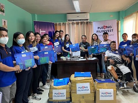 FLI Staff; HR Business Partner in Mindanao, Ms. Erme Angelita Cunanan; and Bago Aplaya Barangay Captain Marlon Campos.