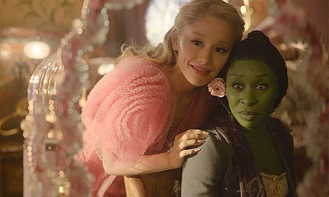 Pop superstar Ariana Grande appears as Glinda, and Cynthia Erivo as Elphaba.