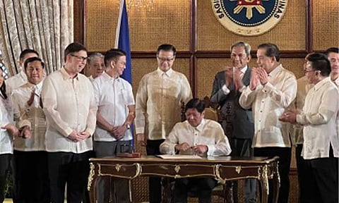 NEW LAW. President Ferdinand R. Marcos Jr. signs the Value Added Tax (VAT) on Digital Services Law at Malacañan Palace on Wednesday (Oct. 2, 2024). To be known as Republic Act 12023, the new law imposes a 12 percent VAT on foreign digital service providers, such as Netflix, Disney, and HBO, to generate additional revenue for the government and level the playing field for local providers. (PNA photo by Darryl John Esguerra)