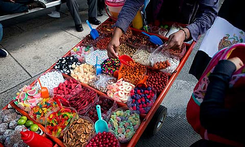 A street vendor sells sweet snacks in Mexico City, July 5, 2016. 