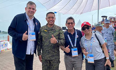 PSC Chairman Richard Bachmann (left most), AFP Chief-of-Staff Gen. Romeo Brawner, Jr. (second left), and PSC Comm. Walter Francis Torres (third left) during the opening rites of the 2024 ICF Dragon Boat World Championships in Puerto Princesa City, Palawan.