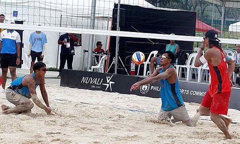 STUNNING WIN. Philippines’ Ran Badilla and James Buytrago (blue) secure a 2-1 victory over their Japanese rivals in the Asian Senior Beach Volleyball Championship at the Nuvali Sand Courts in the City of Santa Rosa, Laguna.