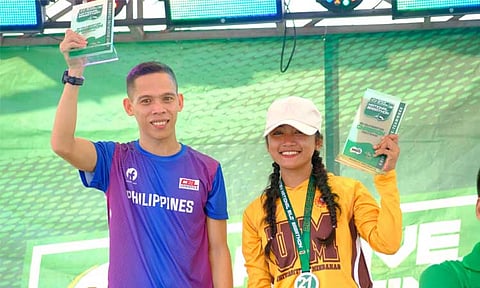 HALF-MARATHON CHAMPS. Multi-titled runners Sonny Wagdos and Lyka Catubig of Davao City celebrate their title victories in men’s and women’s 21K categories, respectively, as the National Milo Marathon 2024 Davao Leg concluded on Sunday morning, November 17, 2024 at SM Lanang Premier grounds.