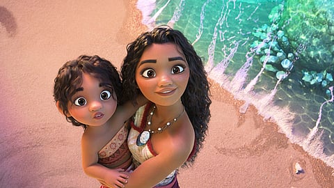 USA. This image released by Disney shows the characters Moana, voiced by Auli'i Cravalho, holding Simea, voiced by Khaleesi Lambert-Tsuda, in a scene from "Moana 2." 