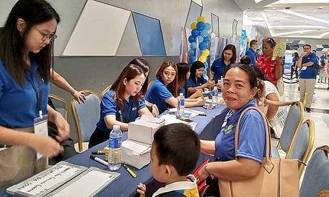 Securing her son’s future. Christine Caberte knows the importance of establishing a foundation for financial independence for her son by opening a BDO Junior Savers account for him during the BDO Fiesta in Bacolod.