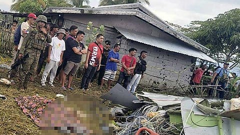 MAGUINDANAO. The body of a victim is covered with a blanket as members of security forces stand around wreckage of airplane in a rice field in Maguindanao del Sur province, Philippines, after officials say a US military-contracted plane has crashed in a rice field in the southern Philippines, killing all four people on board, on Thursday, February 6, 2025.