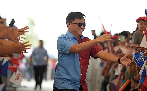 Senator Francis Tolentino shakes hands with the Alyansa para sa Bagong Pilipinas rally attendees in Carmen, Davao del Norte on Saturday, February 15, 2025.