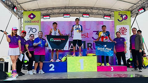 MEN’S FASTEST. Joerge Andrade of Kapatagan, Digos City, (center), stands with fellow podium finishers of the men’s 30K race during the awarding ceremony of the EastWest Dream Run 2025 Davao leg, held Sunday, April 6, at Azuela Cove in Lanang, Davao City. 