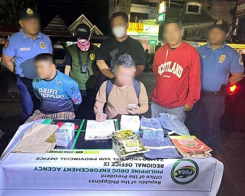 ZAMBOANGA. Authorities arrested Nasrodin Acmad (seated, left) and seized approximately P6.8 million worth of illegal drugs during an anti-drug operation on Wednesday, May 7, in San Carlos village, Tukuran, Zamboanga del Sur. 