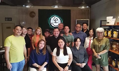 pose. Precious Brew Cafe team with Cebu online news reporters and content creators.