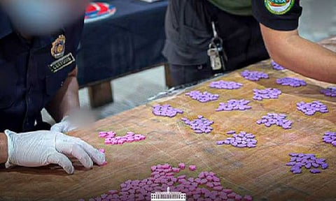 PARTY DRUGS. Agents of the Philippine Drug Enforcement Agency conduct an inventory on the PHP5 million worth of ecstasy tablets seized in Pampanga on June 4, 2025. The Bureau of Customs on Monday (June 16) said the illegal drugs were concealed in a shipment declared as "animal food." (Photo courtesy of BOC)