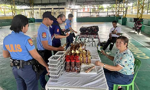 
Personnel from the Pampanga Police Provincial Office check for bargains at the "Kadiwa ng Pangulo" bazaar held at the covered court of Pampanga police camp in Barangay Sto. Niño, City of San Fernando on July 15. (Photo courtesy of Pampanga police)