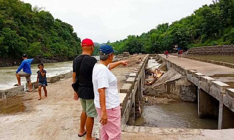 'CRISING' AFTERMATH. Officials of Moises Padilla, Negros Occidental assess on Sunday (July 20, 2025) the damage to the overflow connecting Barangays Montilla and Macagahay in the town, following three days of torrential rains that caused floods due to southwest monsoon enhanced by Severe Tropical Storm Crising. The NDRRMC on Monday (July 21) said two were confirmed dead while some 225,985 families were affected by these weather disturbances. (Photo courtesy of LGU-Moises Padilla)
