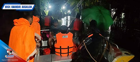 EVACUATION. Residents in Barangay (village) Umanday in Bugallon town, Pangasinan evacuate on Monday (July 21, 2025) night due to flooding. A total of 91 families or 268 individuals have been evacuated from their residences as of Tuesday (July 22) due to flooding, according to the Pangasinan Provincial Disaster Risk Reduction and Management Office. 