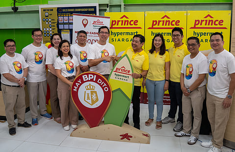 Center: TG Limcaoco, BPI President and Chief executive officer, and Robert Go, Prince Hypermart President, joined by (from left) BPI’s Bong Lualhati, Agency Banking Product Management Head; Alex Seminiano, Chief Technology Officer; Cathy Santamaria, Chief Customer and Marketing Officer; Ginbee Go, Consumer Banking Head; Rally Jereza, Agency Banking Head; Prince Hypermart’s Rissa Go, Chief Finance Officer; John Go, Chief Property Officer; Dennis Fronda, Branch Stores Channel Group Head; and Noel Marcos, Institutional Banking Division Head for Vismin. 
 
