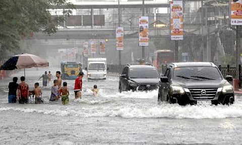 WATER CITY. Motorists pass through the gutter-deep flood along España Boulevard near Vicente Cruz Street in Manila on July 22, 2025, after a downpour. A large portion of the country experienced inclement weather in late July due to the enhanced southwest monsoon and a succession of three tropical cyclones. (PNA photo by Yancy Lim)