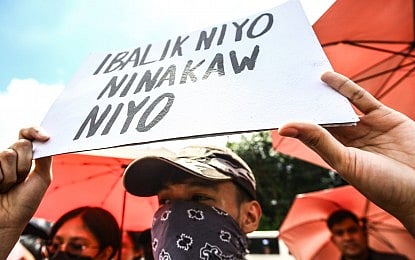 ACCOUNTABILITY. A protester holds a poster during an anti-corruption rally in Quezon City on Saturday (Sept. 13, 2025). The Armed Forces of the Philippines said it is currently on red alert status and stands ready to assist the national police to ensure peace and order. (PNA photo by Joan Bondoc)