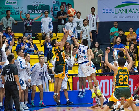 OVERTIME TRIGGER. University of San Jose-Recoletos (USJ-R) Jaguar Cubs skipper Clyve Heinrich Antig draws a foul from Cebu Eastern College (CEC) defender John Denver Jopia while taking a three-pointer. Antig sank all his three free throws thereafter to send the game into overtime, where USJ-R outlasted CEC, 70-62.  / 