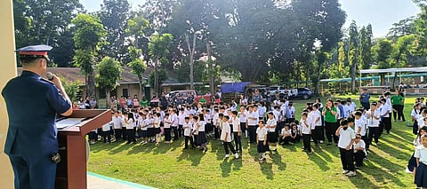ILOILO. Police Colonel Bayani M. Razalan, provincial director of the Iloilo Police Provincial Office, leads the flag-raising ceremony at General Martin Teofilo Delgado Elementary School in Santa Barbara, Iloilo on September 15, 2025, under the “Oplan Balik Eskwela” initiative to ensure a safe and secure school environment.