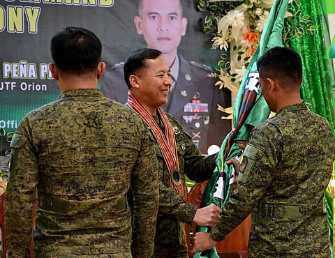 ZAMBOANGA. Major General Leonardo Peña, 11th Infantry Division (11ID) and Joint Task Force Orion commander (center) hands over the unit symbol to Lieutenant Colonel Donato Molina, Jr., who was assigned as the new commander of the 11th Service Support Battalion (11SSBn), replacing Lieutenant Colonel Jay Remotigue. The 11SSBn’s change of command ceremony was held on Tuesday, September 23, at Camp General Teodulfo Bautista in Busbus village, Jolo, Sulu.
