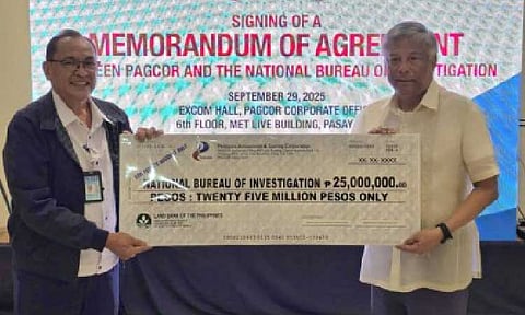 ILLEGAL GAMBLING FIGHT. PAGCOR chairperson and chief executive officer Alejandro Tengco (right) turns over on Monday (Sept. 29, 2025) a mock check worth PHP25 million to NBI Director Jaime Santiago, representing the first tranche of PAGCOR’s PHP50-million financial grant to the bureau. The amount will be used to strengthen operations against illegal gaming, including the banned Philippine offshore gaming operators. (Photo courtesy of PAGCOR)