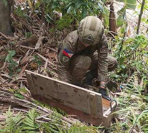 ZAMBOANGA. Troops of the 7th Infantry Battalion recover explosives in a deserted compound in Sitio Kimondo, Barangay Lagandang, Isulan, Sultan Kudarat on Wednesday, October 8. A personnel of the Explosive Ordnance Demolition examined a box containing explosives during the recovery operation.  