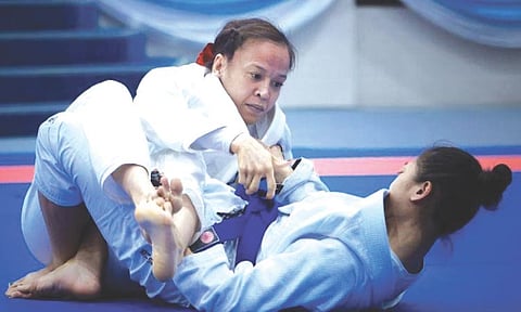 FIRST GOLD. Kimberly Custodio pins down Thai opponent Sugun Nutchaya in their women’s 48kg jiu-jitsu ne-waza final at the 33rd Southeast Asian Games in Bangkok, Thailand. The win gave Custodio a gold medal in her first SEA Games stint.  / 