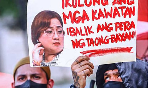 ACCOUNTABILITY. A protester holds a poster with a photo of government contractor Cezarah Discaya during an anti-corruption rally in Quezon City on Sept. 13, 2025. Malacañang said on Friday (Dec. 26, 2025) that more individuals are expected to face accountability in the New Year, as the investigation into flood control anomalies continues. (PNA file photo by Joan Bondoc)