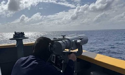 SEARCH AND RESCUE. Officer on the lookout for survivors aboard BRP Jose Rizal (FF150) that is conducting a search and rescue mission for Singapore-flagged bulk carrier MV Devon Bay, which capsized near Bajo de Masinloc on Friday (Jan. 23, 2025). The Philippine Navy on Sunday (Jan. 25) said operations will continue to find the remaining four crew members.