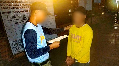 ILOILO. Police officers escort alias Enteng, the top Most Wanted Person in Western Visayas, after his arrest by the Balasan Municipal Police Station in Barangay Poblacion Sur, Balasan, Iloilo, on February 6, 2026, for a qualified rape case. 
