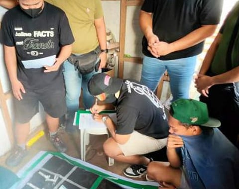 ZAMBOANGA. Anti-drug operatives arrest three high-value individuals as they dismantle a drug den in a law enforcement operation on Friday, February 6, in Tugbungan village, Zamboanga City. 
