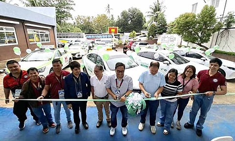 In photo: LTFRB-Davao Regional Director Nonito “Dondon” Llanos and RTOA-11 President Ryan Sia lead the ribbon-cutting ceremony, formally marking the launch of EV taxis under the RTOA fleet. 