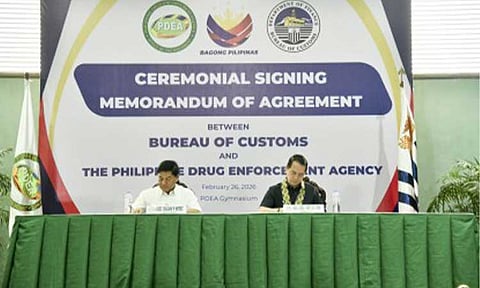 PARTNERS. Philippine Drug Enforcement Agency Director General Undersecretary Isagani Nerez (left) and Bureau of Customs Commissioner Ariel Nepomuceno on Thursday (Feb. 26, 2026) sign a memorandum of agreement to enhance operational coordination to prevent the entry of illegal drugs and controlled precursors and essential chemicals into the country. A central feature of the partnership is the establishment of a Drug Interdiction Task Group, designed to foster closer collaboration between the two agencies. (Photo courtesy PDEA)