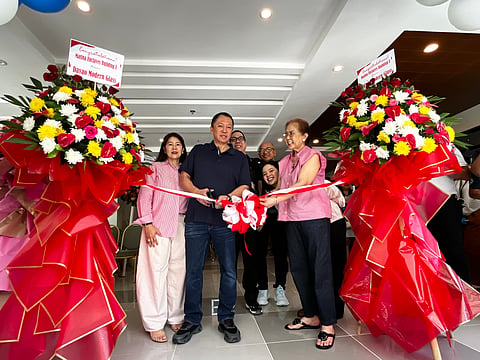 RIBBON-CUTTING CEREMONY. Escandor Development Corp. president and CEO Glenn Escandor (left) and company matriarch Violeta Escandor lead the ceremonial ribbon-cutting for Building E of Matina Enclaves Residences in Davao City, on Friday, April 10, 2026, marking the completion of the project’s five-building mid-rise Phase 1.